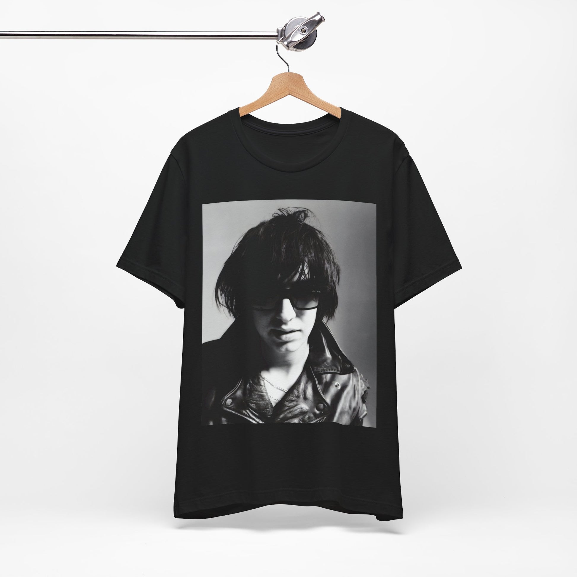 A black graphic t-shirt featuring a graphic related to The Strokes' 'Reptilia' song or era.