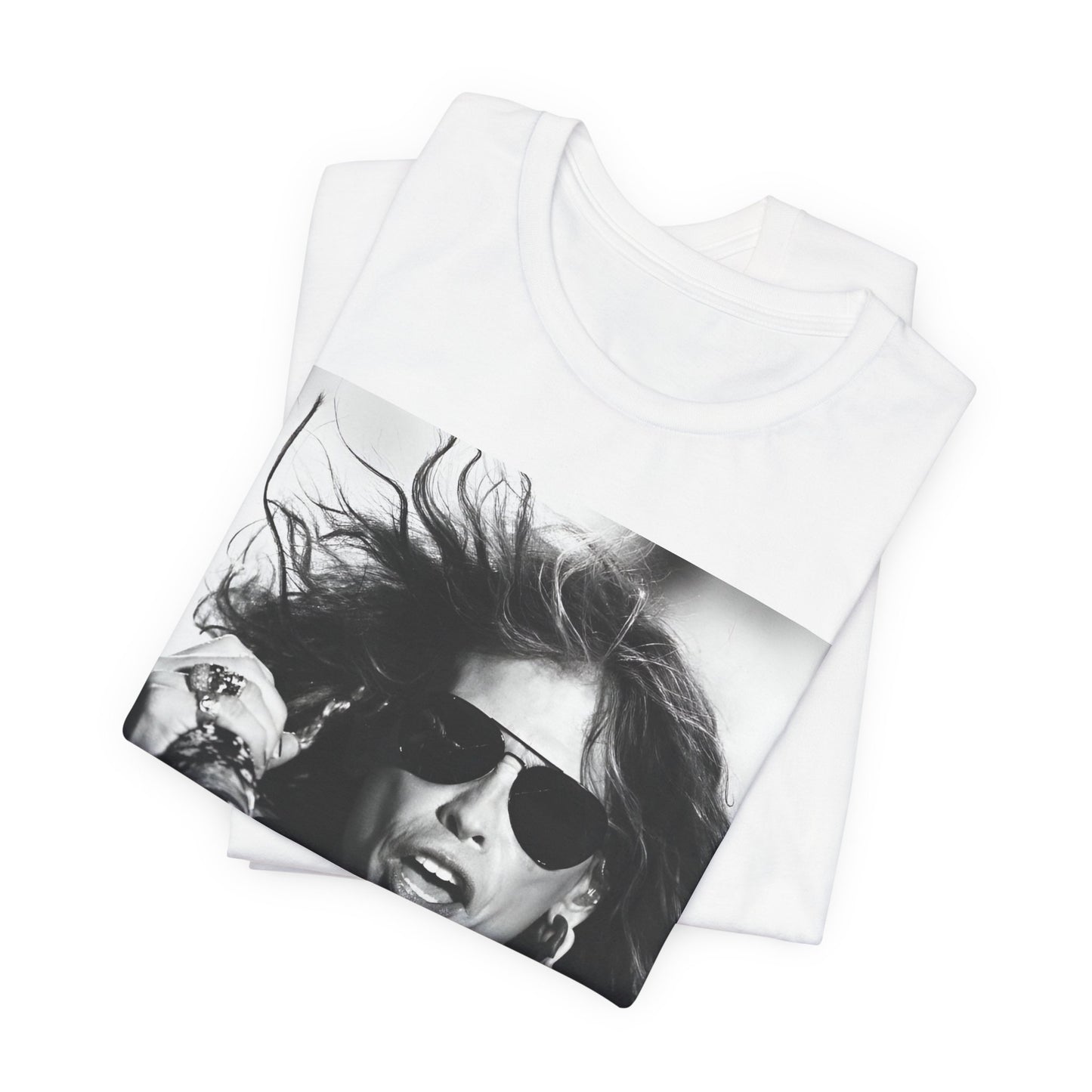 A black graphic t-shirt featuring a black and white photo of Aerosmith's Steven Tyler with his signature scarf and microphone, captured during a dynamic performance.