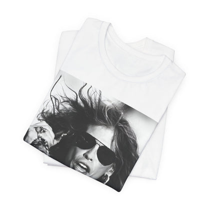 A black graphic t-shirt featuring a black and white photo of Aerosmith's Steven Tyler with his signature scarf and microphone, captured during a dynamic performance.