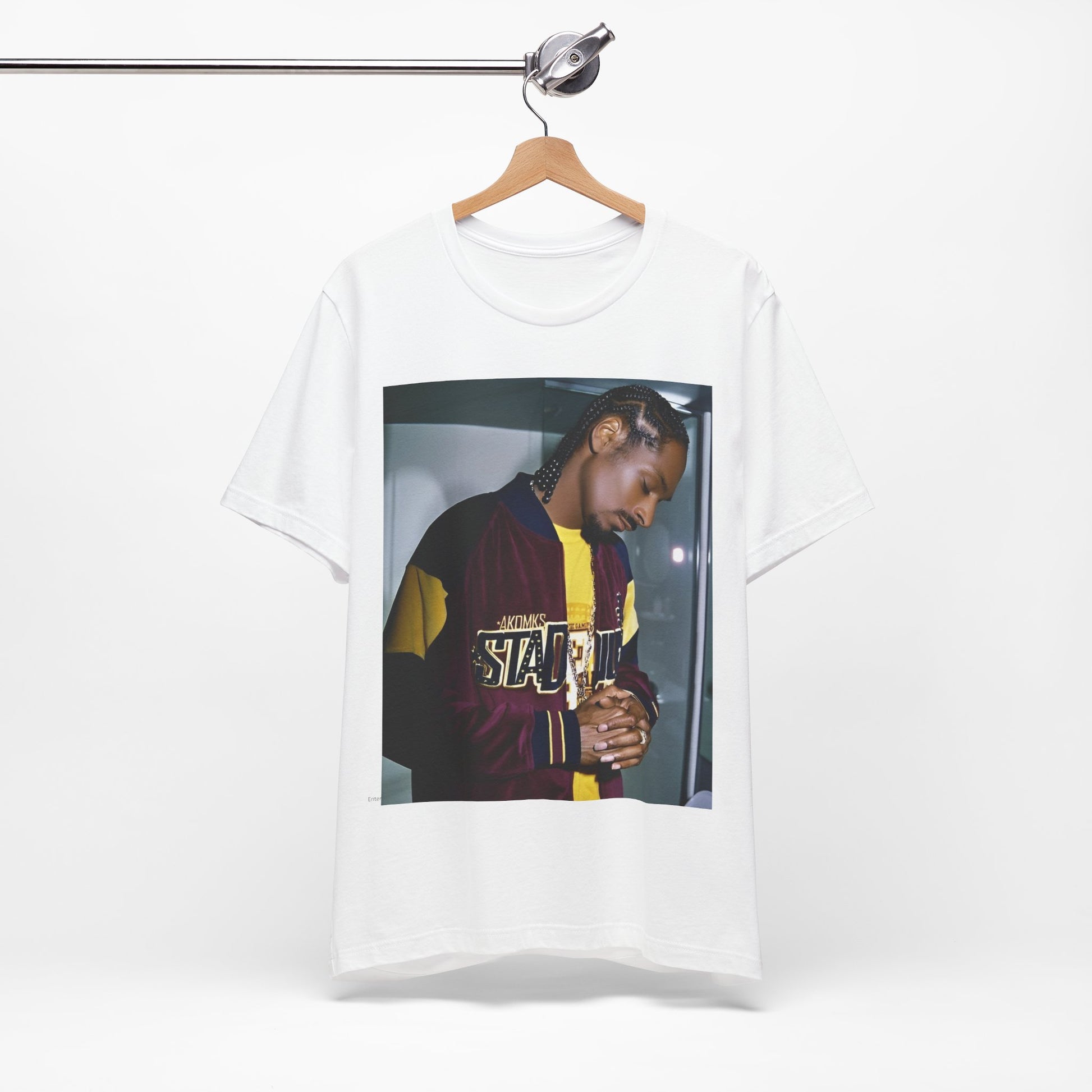 A black graphic t-shirt featuring a classic graphic of Snoop Dogg with a cool gaze.