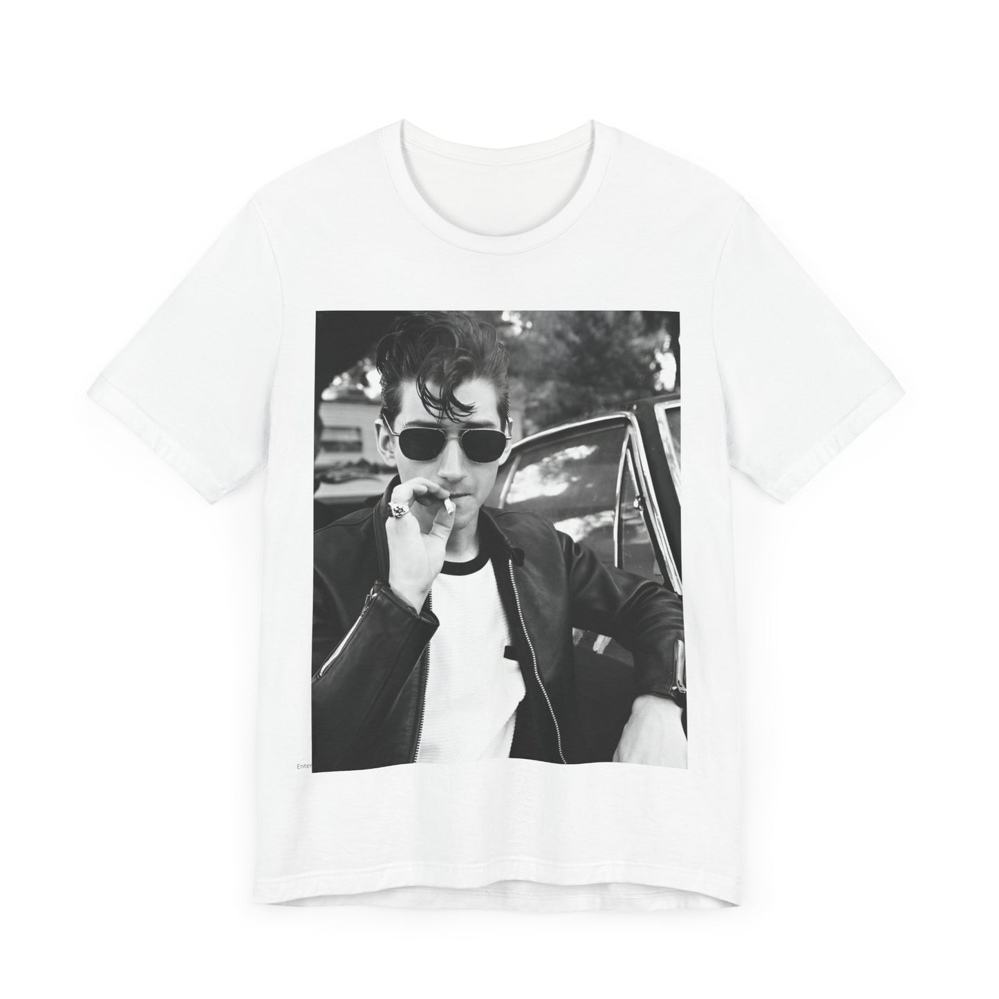 A black graphic t-shirt featuring a classic rock-style graphic of the Arctic Monkeys, possibly with band members in a stylized design.