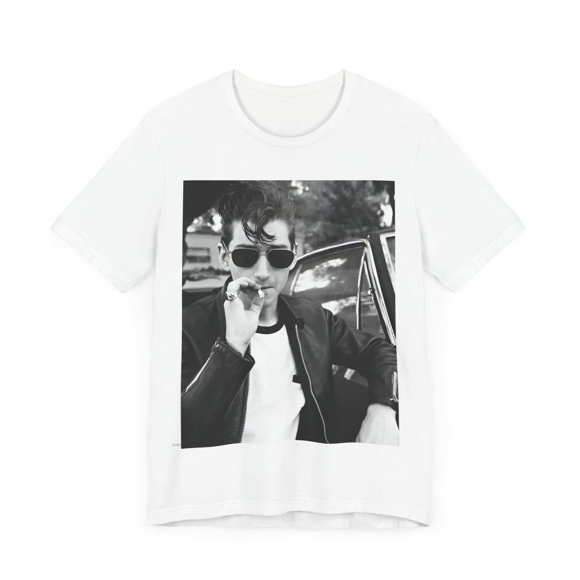 A black graphic t-shirt featuring a classic rock-style graphic of the Arctic Monkeys, possibly with band members in a stylized design.