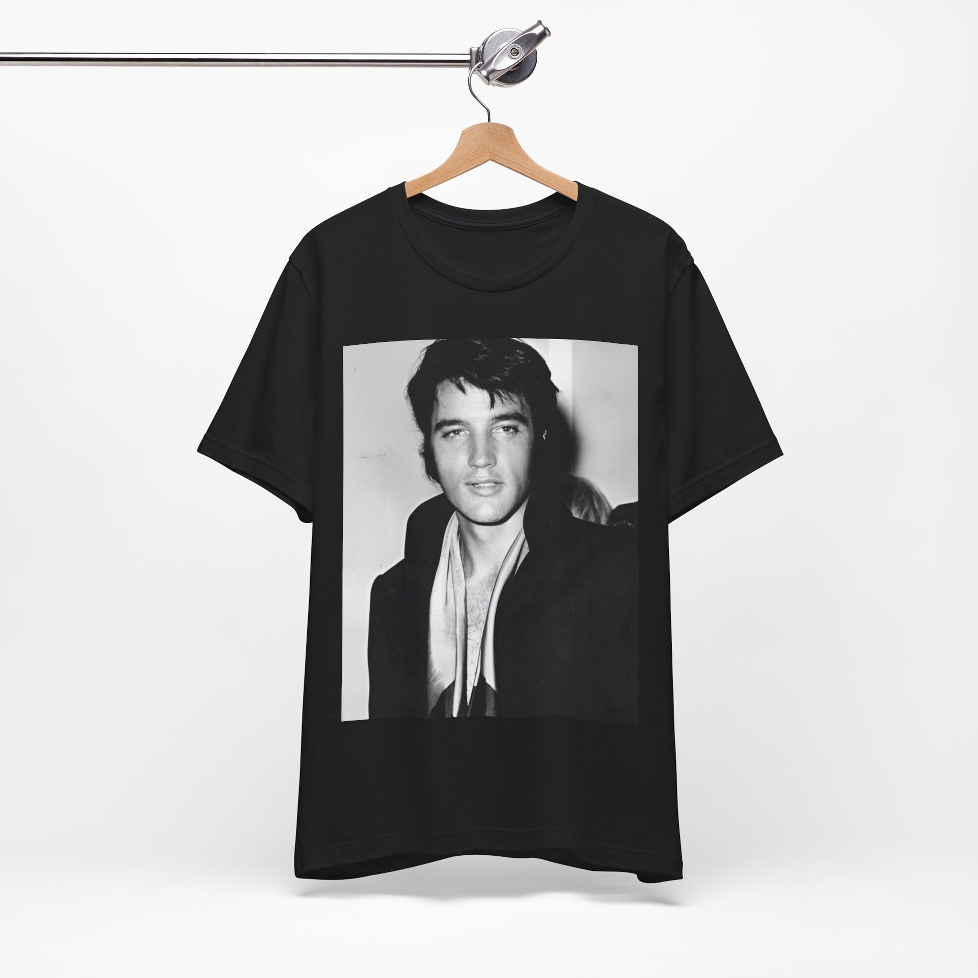 A black graphic t-shirt featuring a black and white rock and roll portrait photo of Elvis Presley.