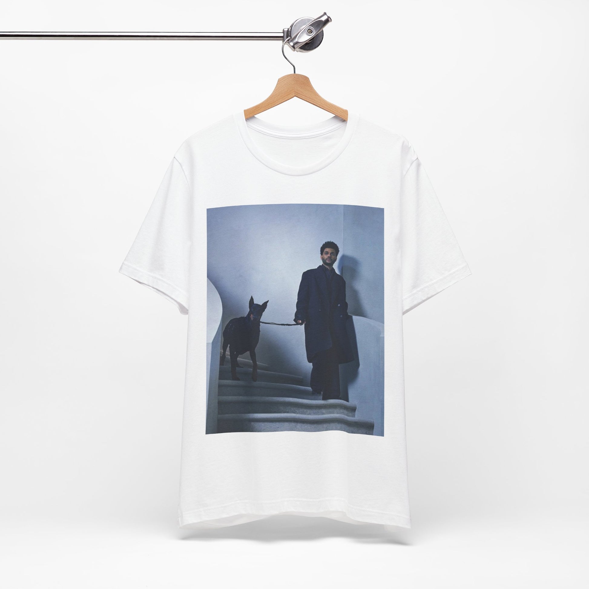 A black graphic t-shirt featuring a photo of The Weeknd with a doberman.