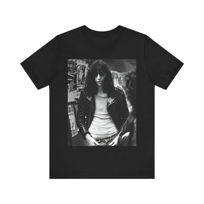 A black graphic t-shirt featuring a 70s black and white photo portrait of Joey Ramone from Ramones.