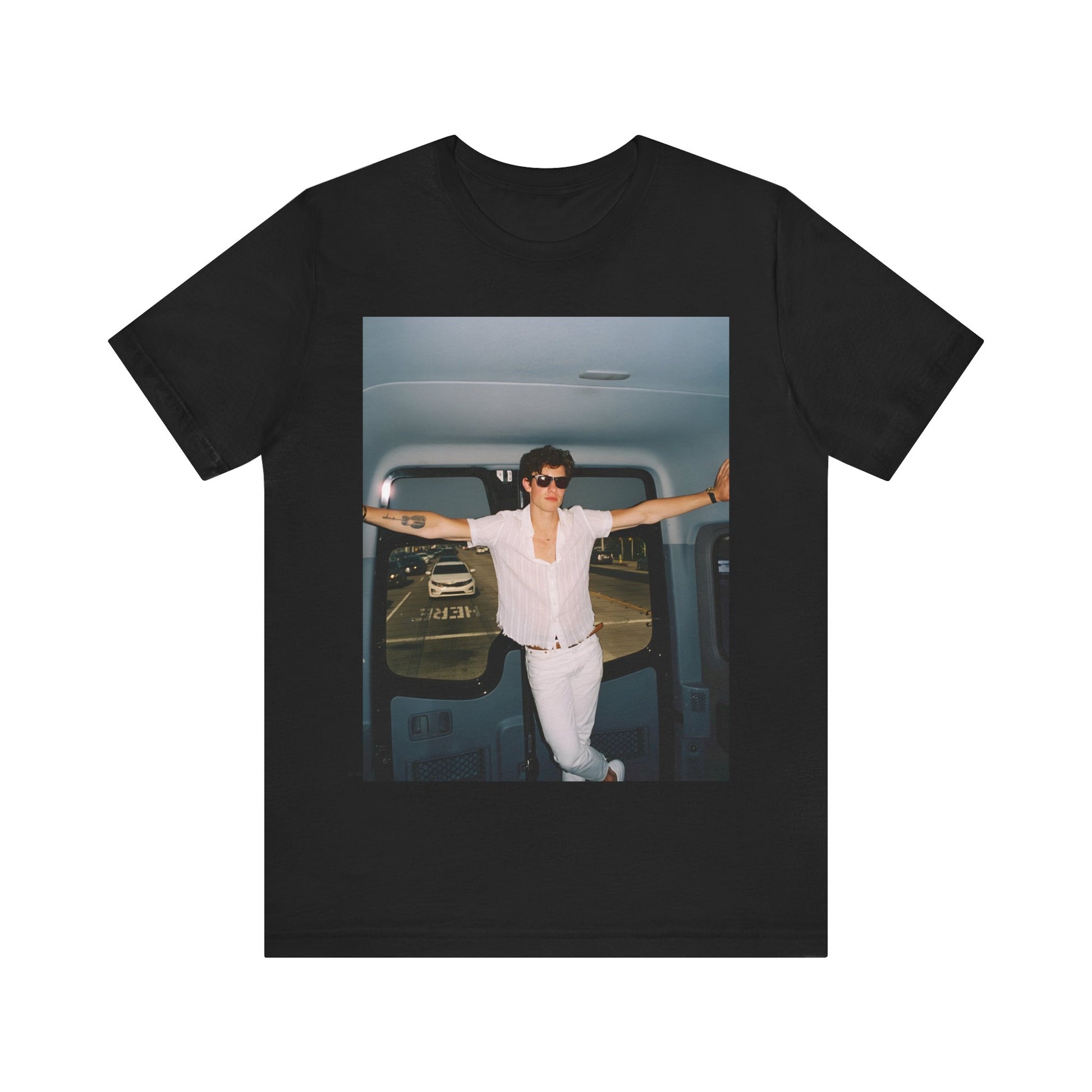 A black graphic t-shirt featuring a graphic of Shawn Mendes with a classic confident look.