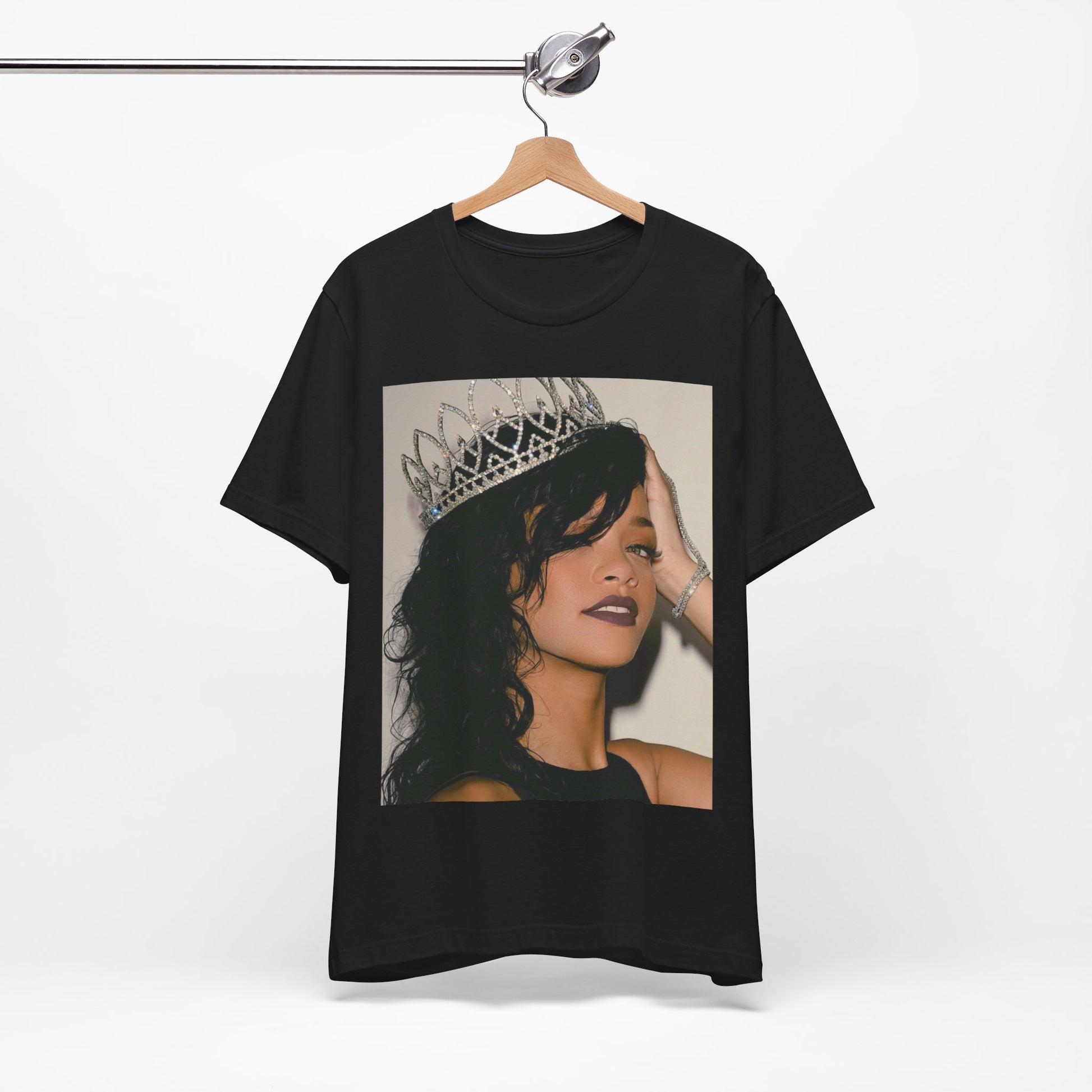A black graphic t-shirt featuring a Y2K pop aesthetic graphic of Rihanna.