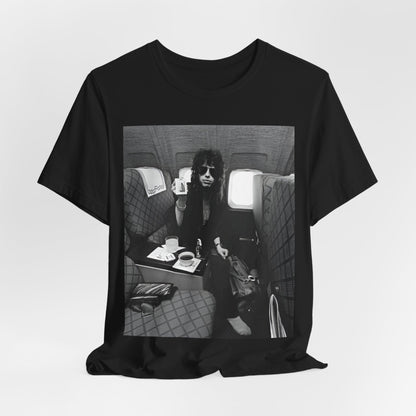 A black graphic t-shirt featuring a vintage 70s-style illustration of an airplane with Aerosmith branding, representing their tour plane from that era.