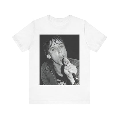 A black graphic t-shirt featuring a 70s graphic or photo of Iggy Pop performing in a wild concert.
