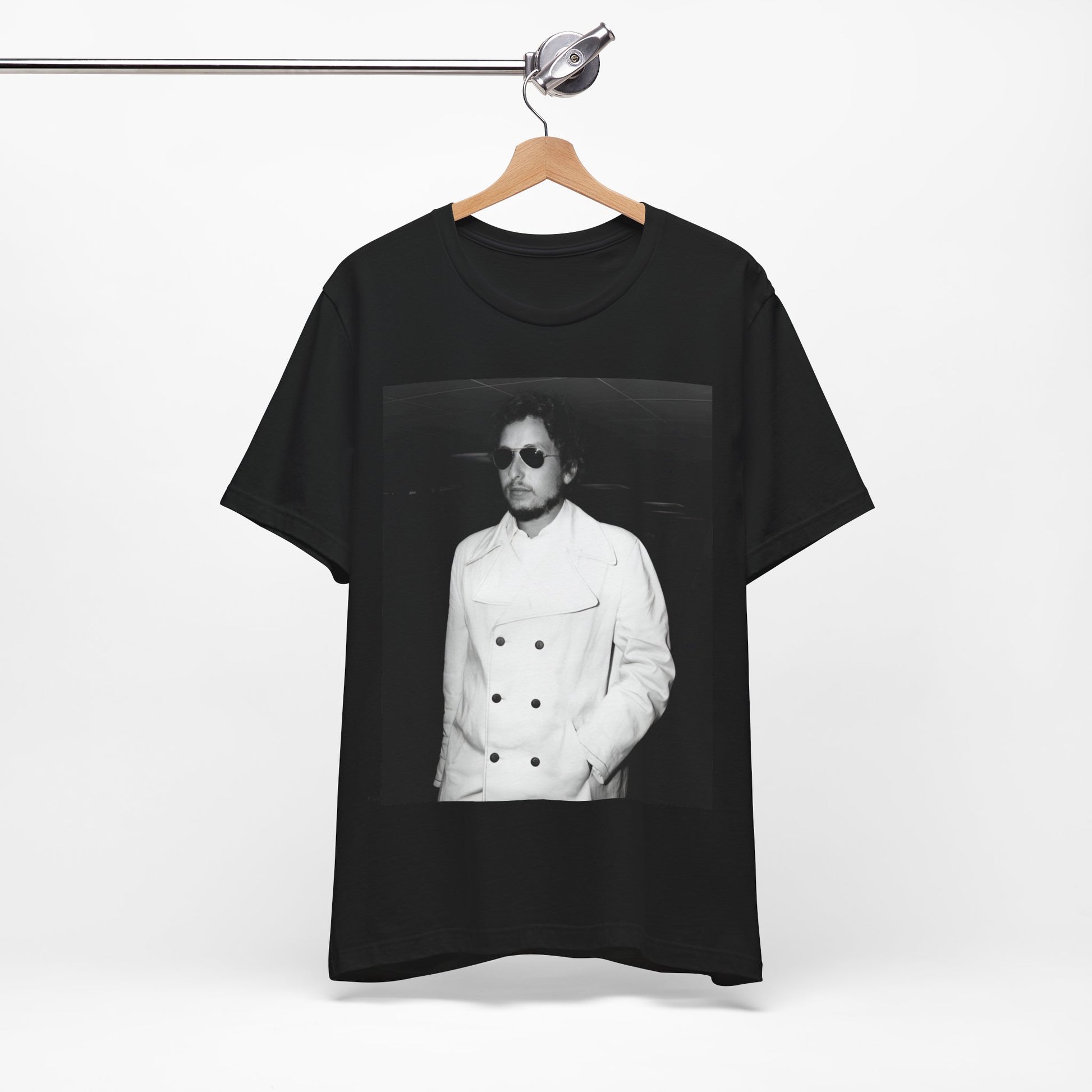 A black graphic t-shirt featuring a vintage black and white photo of Bob Dylan in a contemplative or iconic pose.