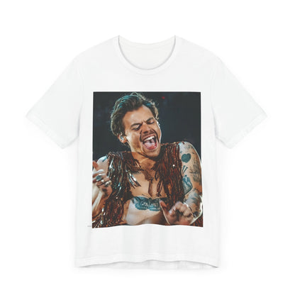 A black graphic t-shirt featuring a graphic or photo of Harry Styles performing live on stage.