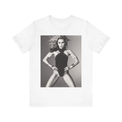 A black graphic t-shirt featuring a bold graphic of Miley Cyrus as a pop superstar.