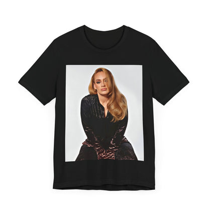 A black graphic t-shirt featuring a portrait of Adele from her iconic blonde era, with her hair styled and her expression poised and elegant.
