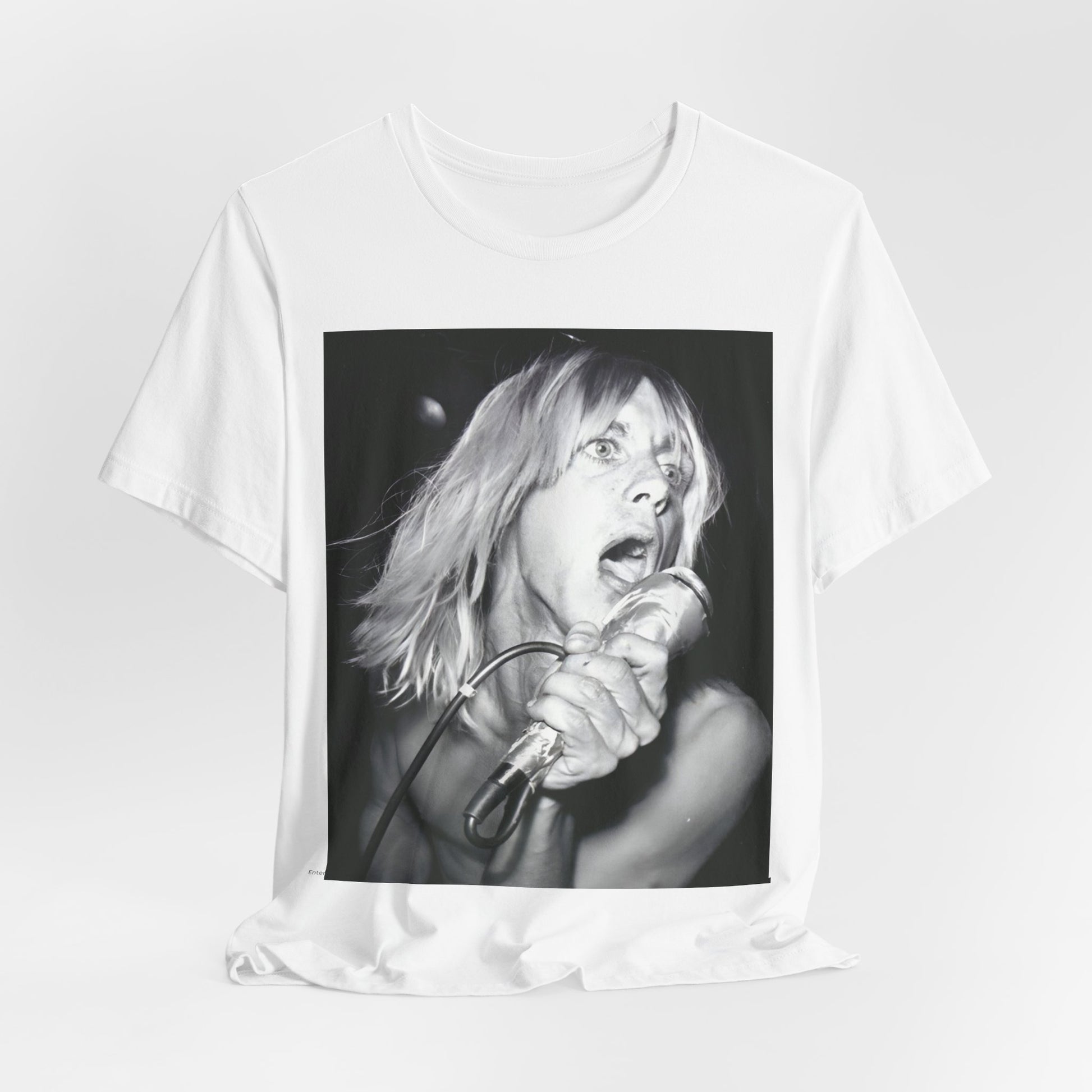A black graphic t-shirt featuring a graphic of Iggy Pop as the Godfather of Punk, performing live.