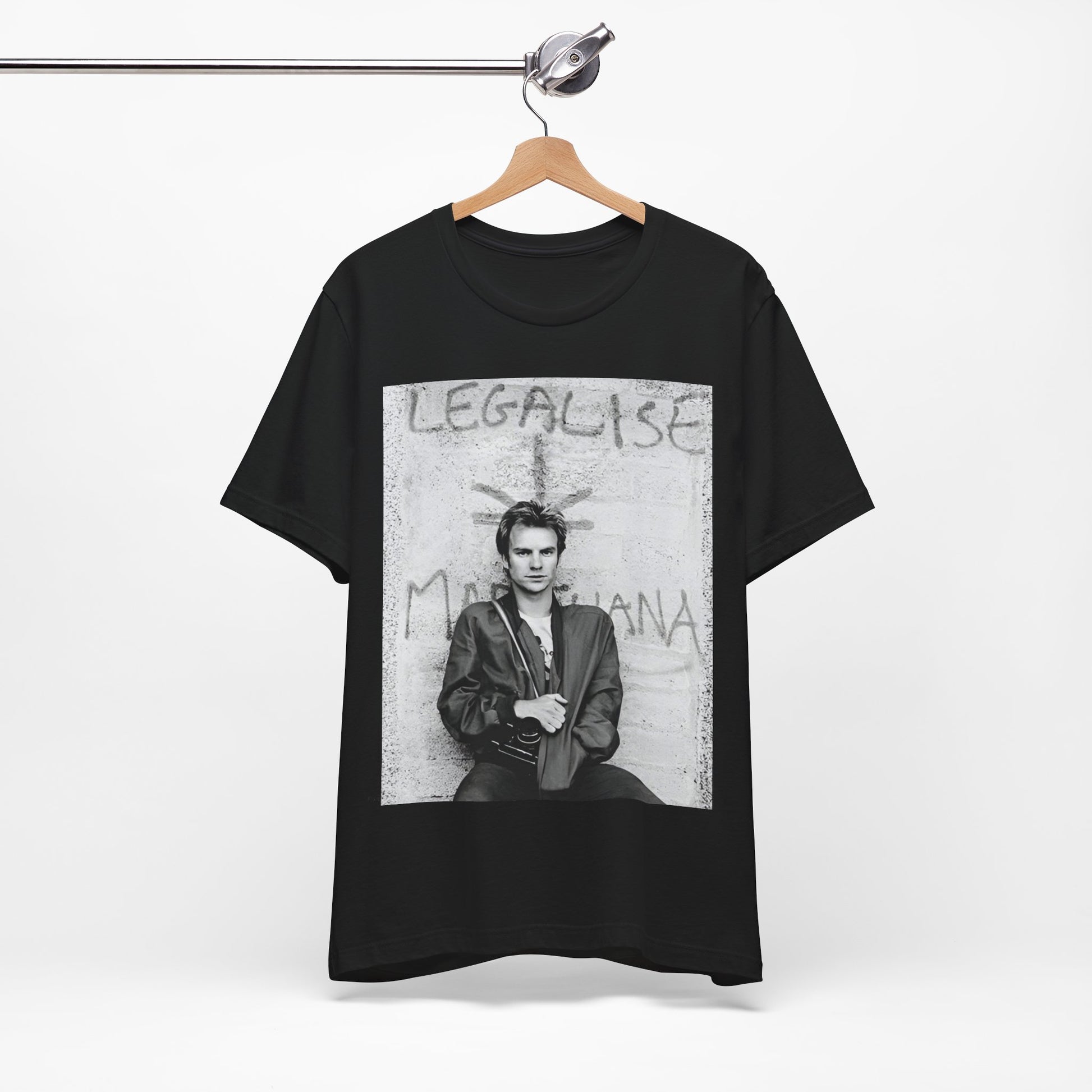 A black graphic t-shirt featuring a graphic of The Police with reggae-influenced pop elements.