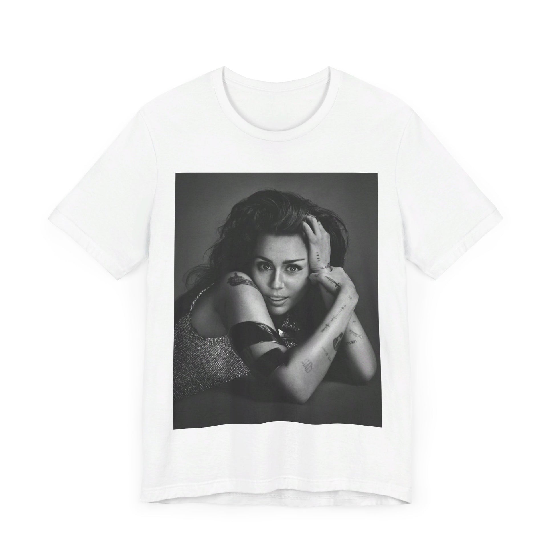 A black graphic t-shirt featuring a black and white portrait graphic of Miley Cyrus.