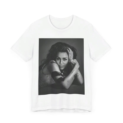 A black graphic t-shirt featuring a black and white portrait graphic of Miley Cyrus.