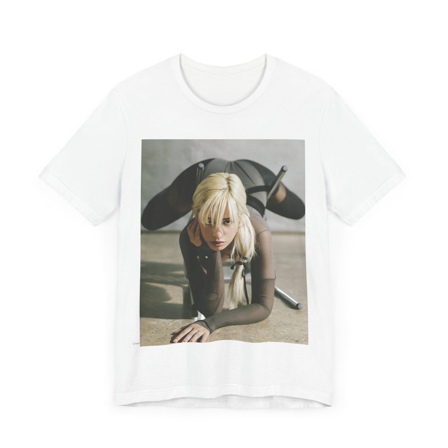 A black graphic t-shirt featuring a vintage-style graphic of Camila Cabello, possibly with a crown or 'Pop Queen' title.