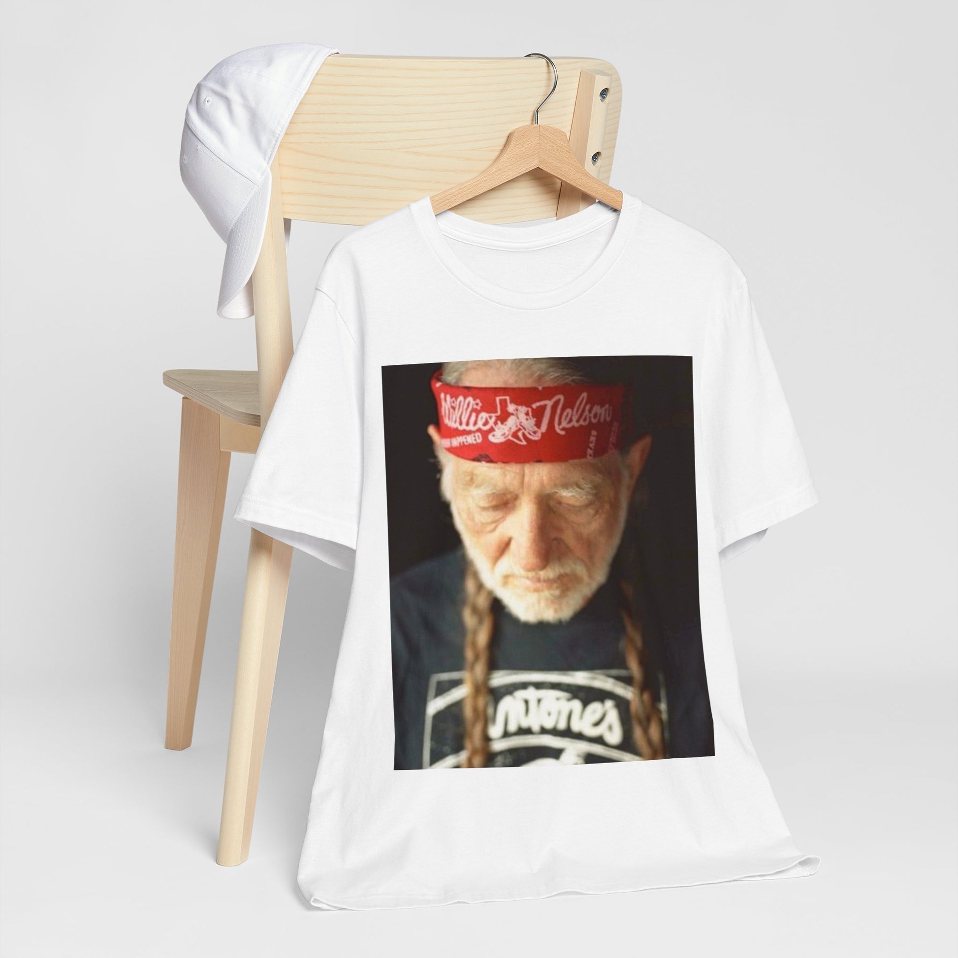 A black graphic t-shirt featuring a Texas music aesthetic graphic of Willie Nelson.