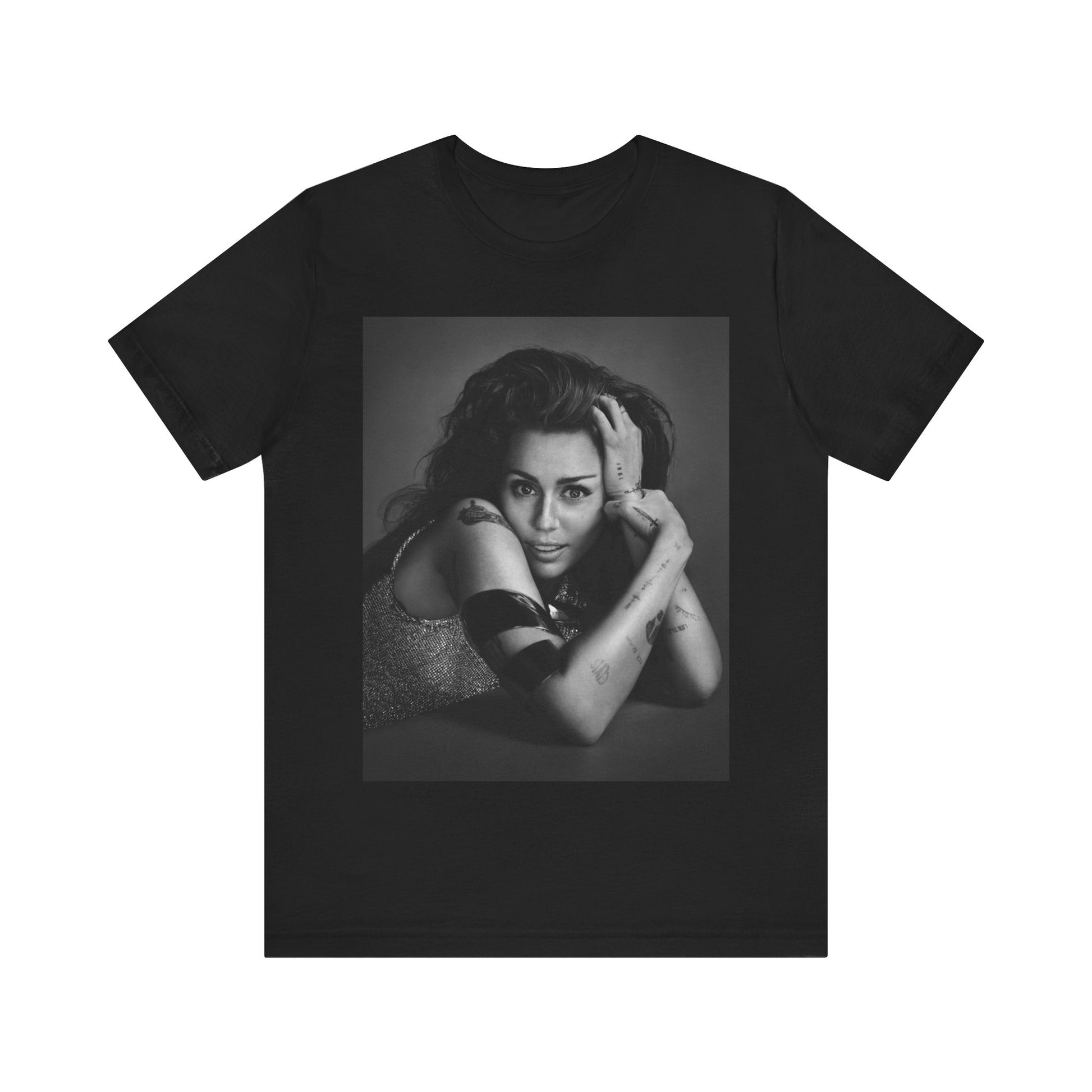 A black graphic t-shirt featuring a black and white portrait graphic of Miley Cyrus.