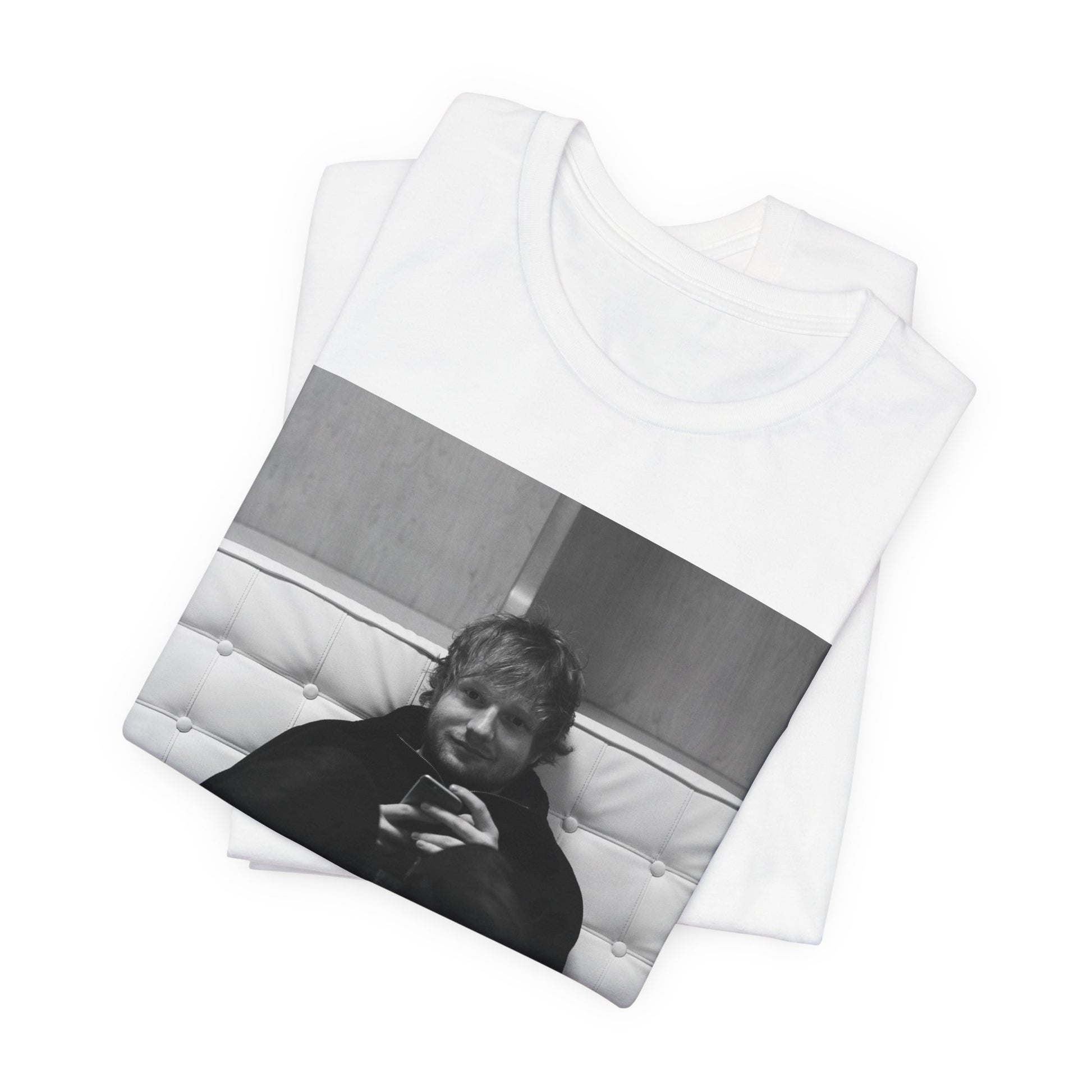 A black graphic t-shirt featuring a bold black and white graphic of Ed Sheeran.