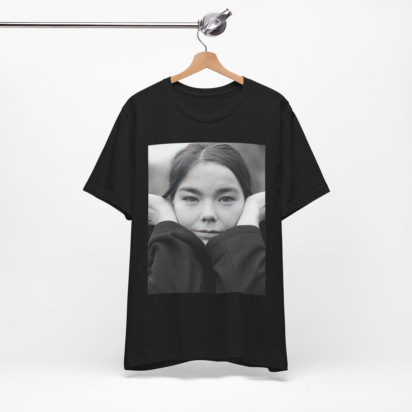 A black graphic t-shirt featuring a black and white portrait photo of Bjork.