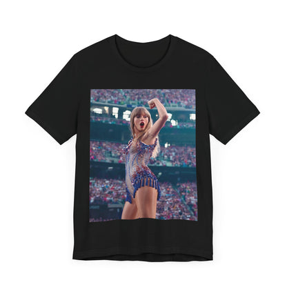 A black graphic t-shirt featuring a graphic or photo of Taylor Swift performing live on stage.