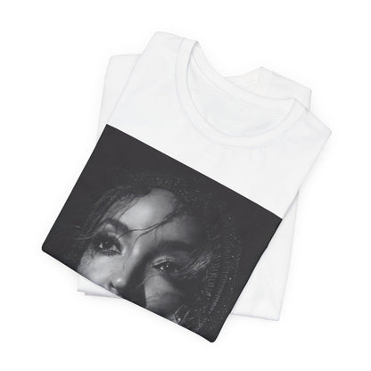 A black graphic t-shirt featuring a black and white portrait photo of Tinashe.