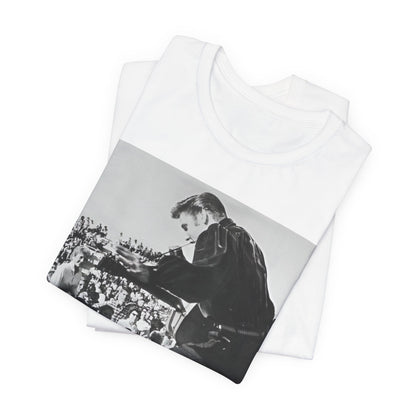 A black graphic t-shirt featuring a retro photo of Elvis Presley performing live in concert in the 1950s.