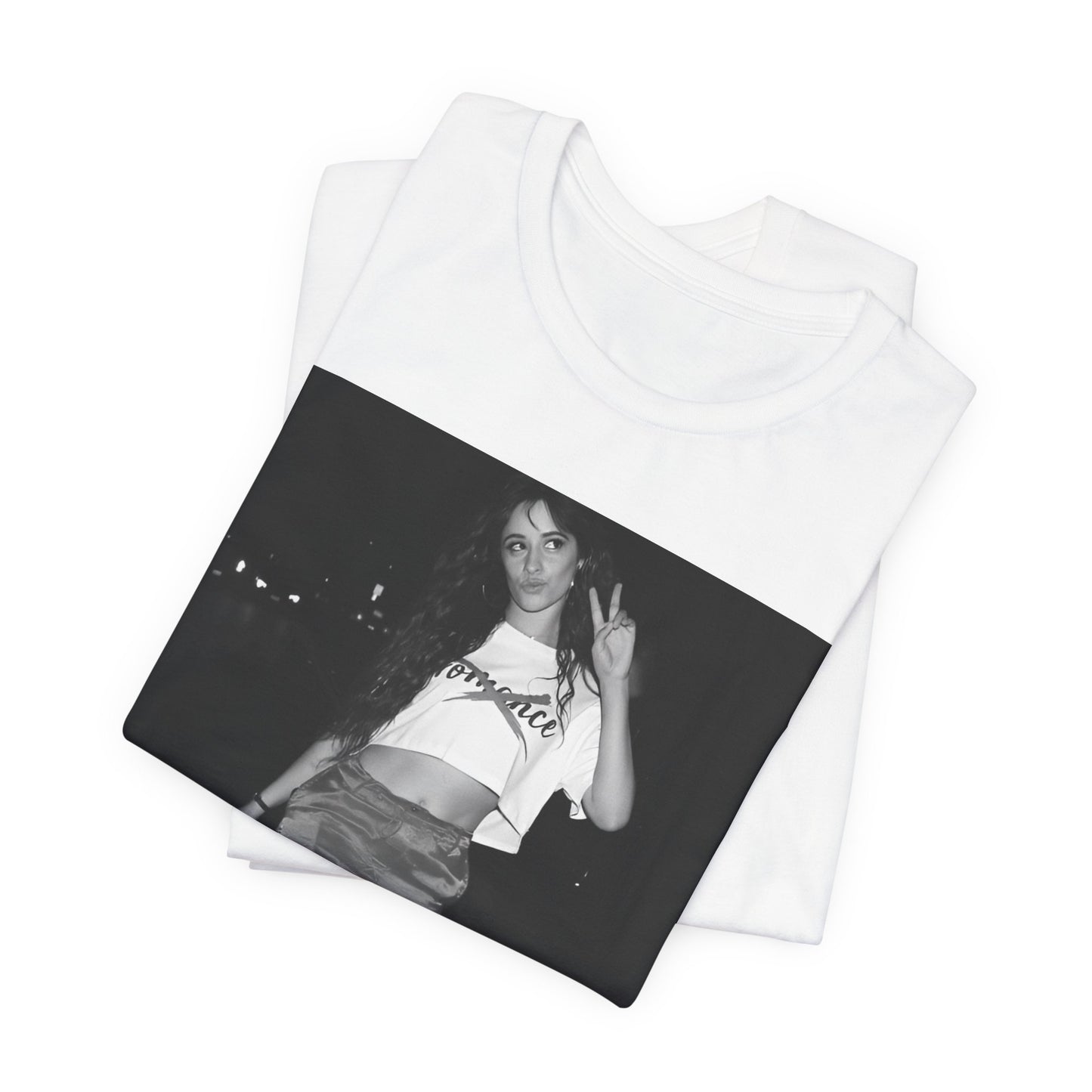 A black graphic t-shirt featuring a photo of Camila Cabello from her "Romance" album era.