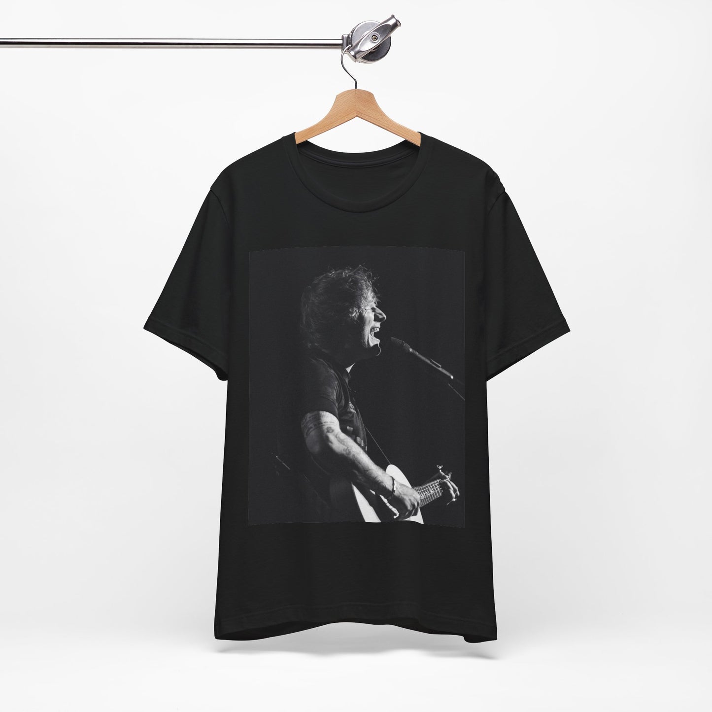 A black graphic t-shirt featuring a graphic related to Ed Sheeran's stadium tour.