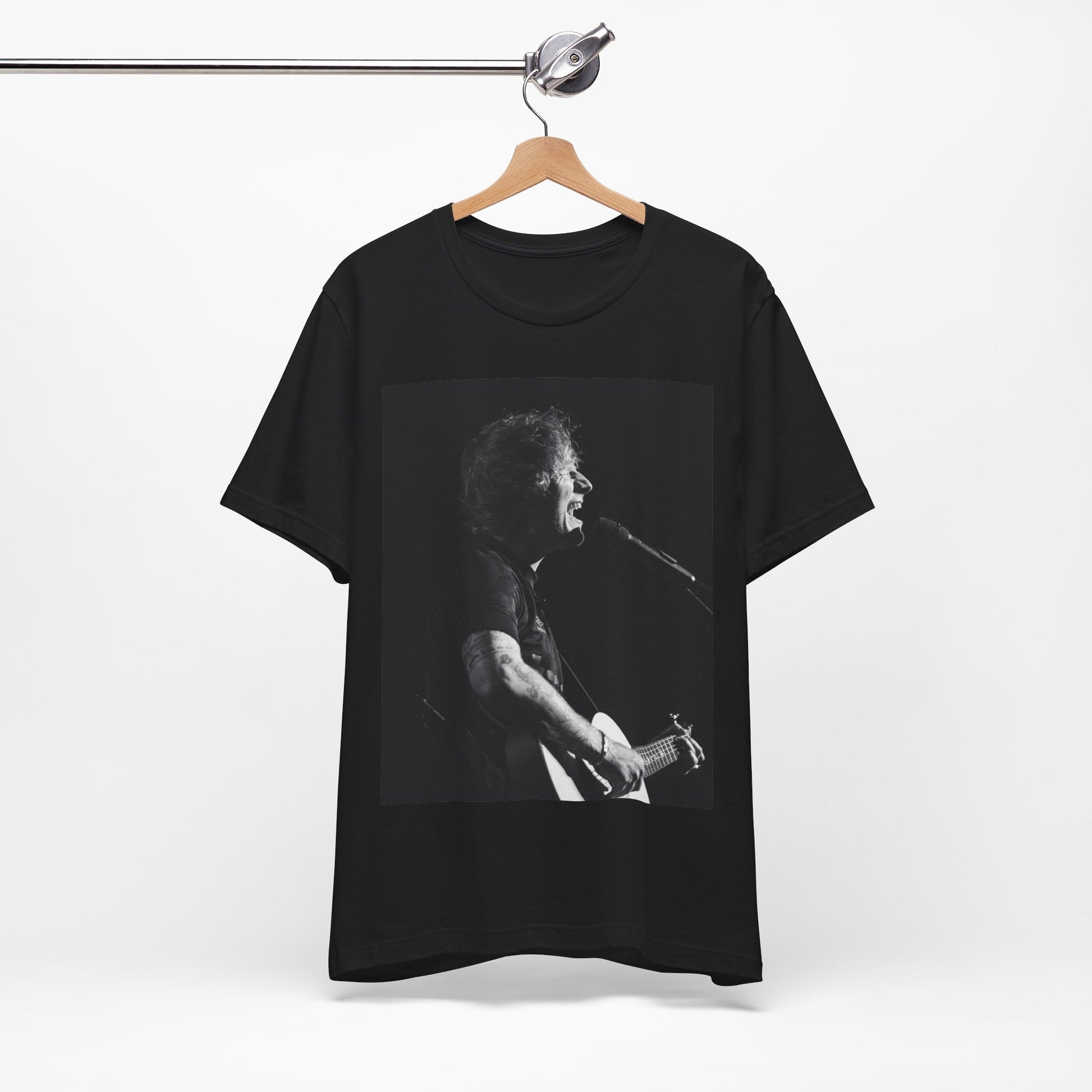 A black graphic t-shirt featuring a graphic related to Ed Sheeran's stadium tour.
