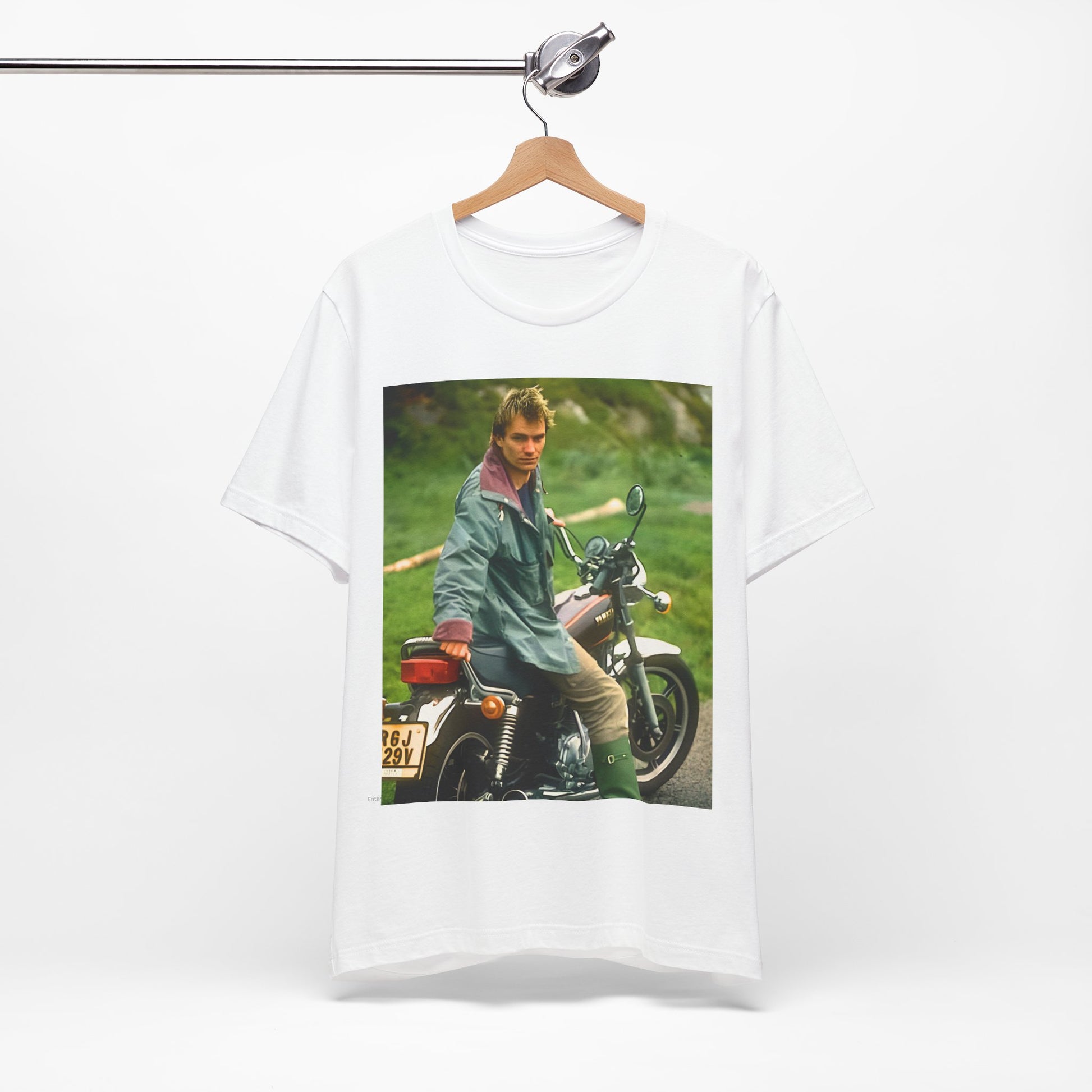 A black graphic t-shirt featuring a graphic of Sting from The Police with a motorcycle theme.