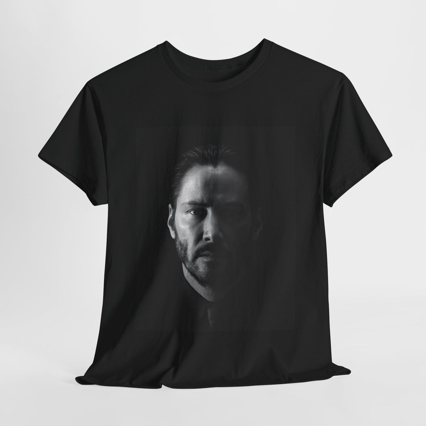 A black graphic t-shirt featuring a graphic of Keanu Reeves as John Wick.