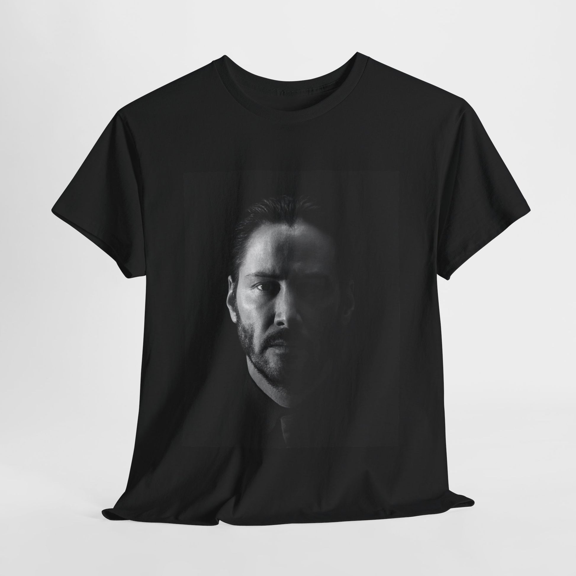 A black graphic t-shirt featuring a graphic of Keanu Reeves as John Wick.
