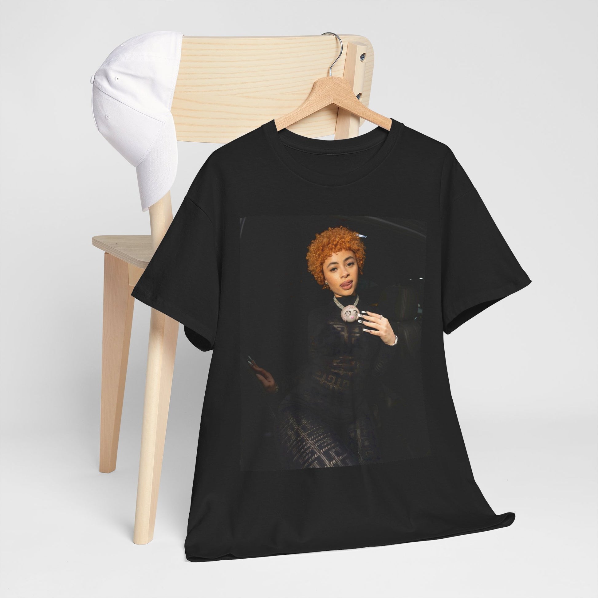 A black graphic t-shirt featuring a graphic of Ice Spice with her classic curly red hair, designed with an aesthetic style.