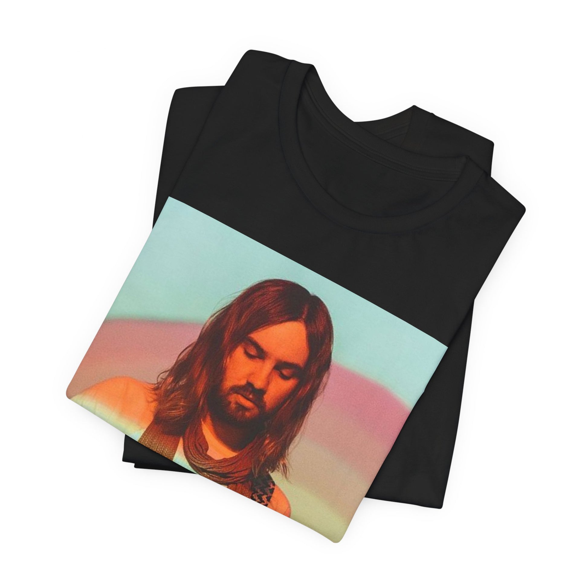 A black graphic t-shirt featuring a dream rock aesthetic graphic of Tame Impala.