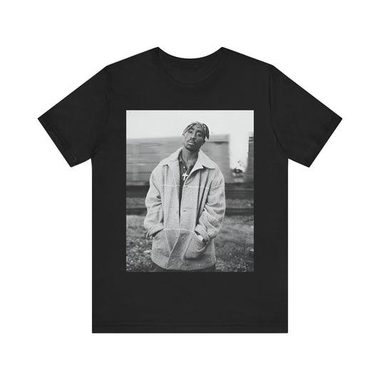 A black graphic t-shirt featuring a graphic related to Tupac's 'Thug Life' philosophy.