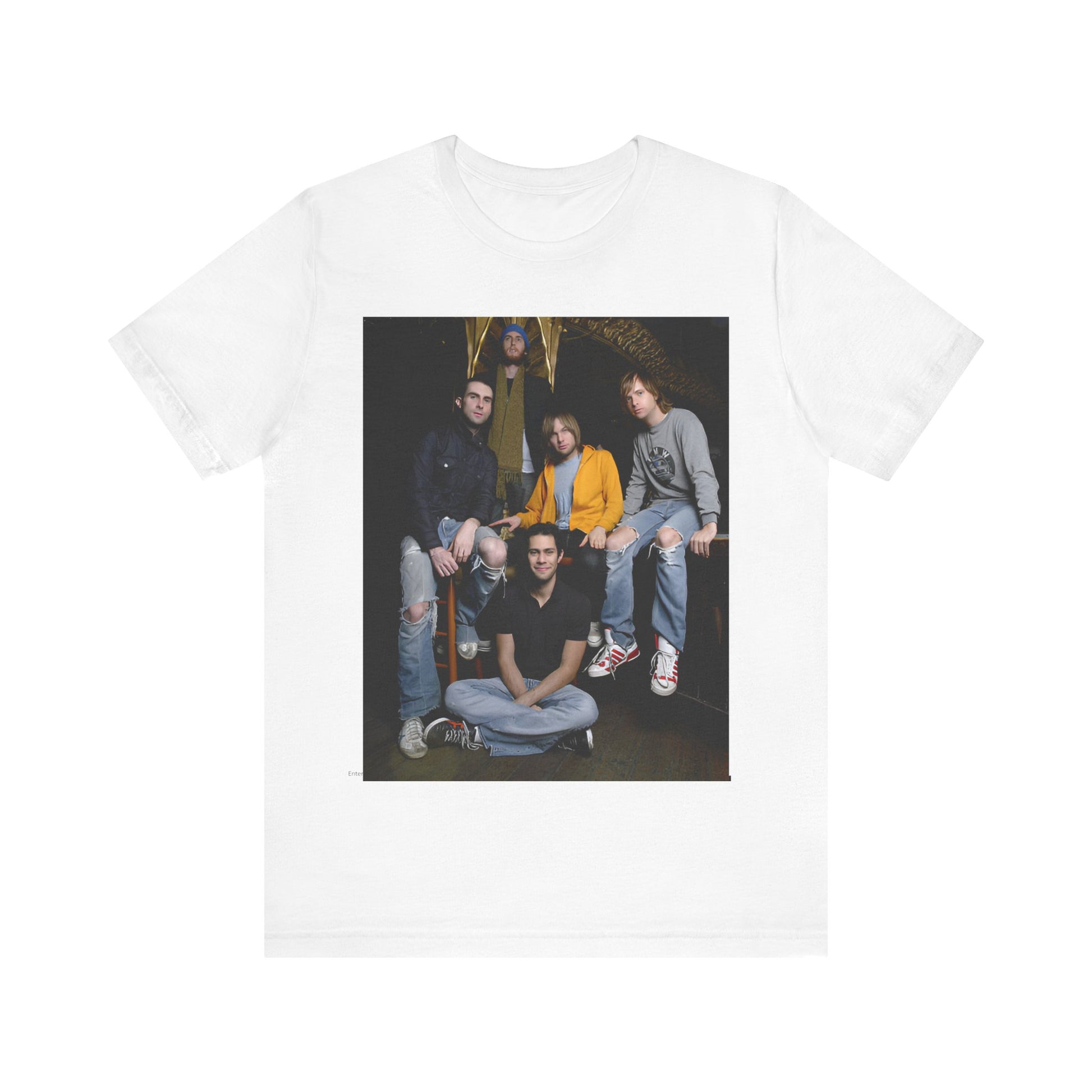 A high-energy, colorful photo of Maroon 5 performing live on stage at a concert, printed on a graphic t-shirt.