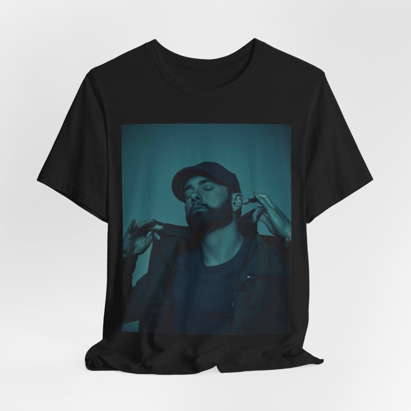 A black graphic t-shirt featuring a graphic of Eminem as a 'Rap God'.
