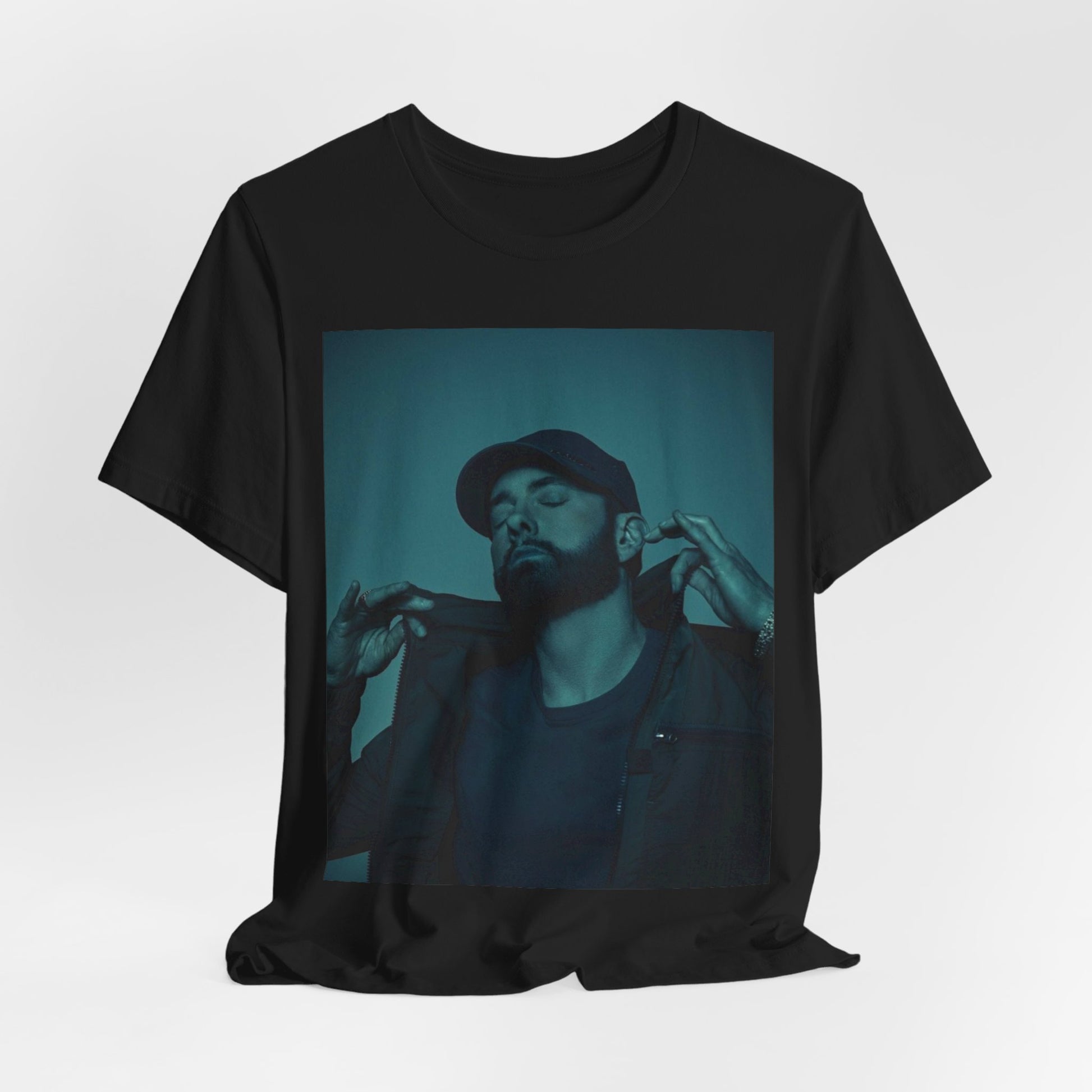 A black graphic t-shirt featuring a graphic of Eminem as a 'Rap God'.