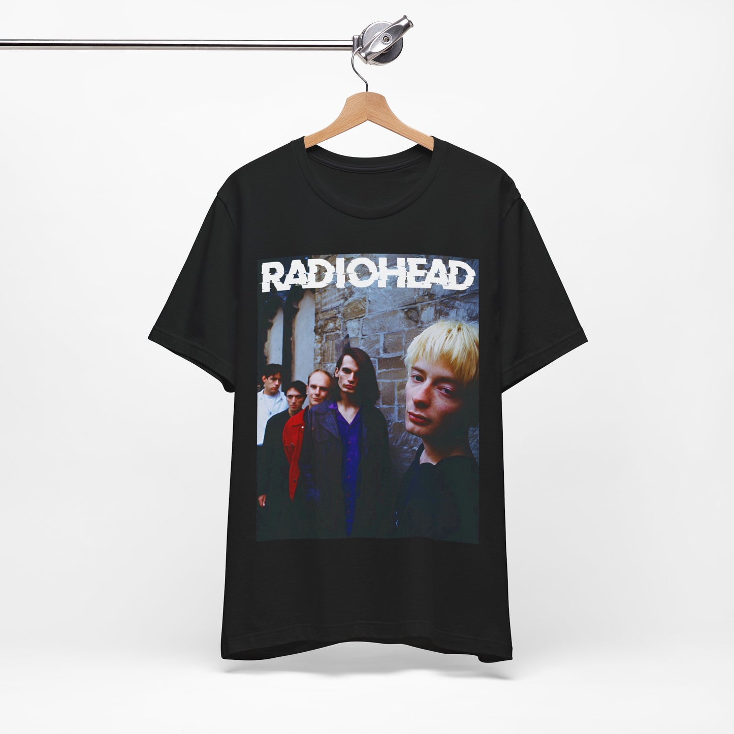A black graphic t-shirt featuring a 90s graphic related to Radiohead's 'Karma Police' song or era.