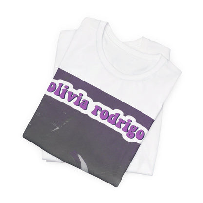 A black graphic t-shirt featuring a graphic or photo of Olivia Rodrigo performing live on stage.