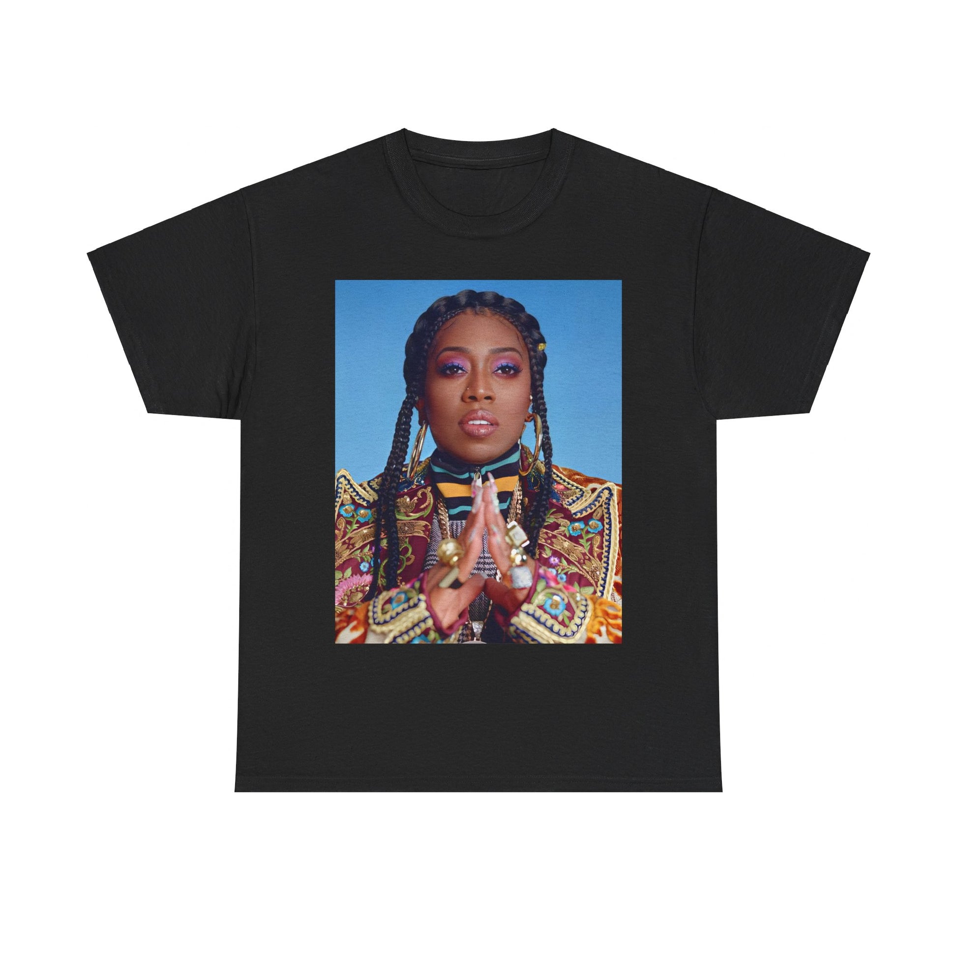 A black graphic t-shirt featuring a graphic of Missy Elliott with a cool, futuristic rap fashion aesthetic.