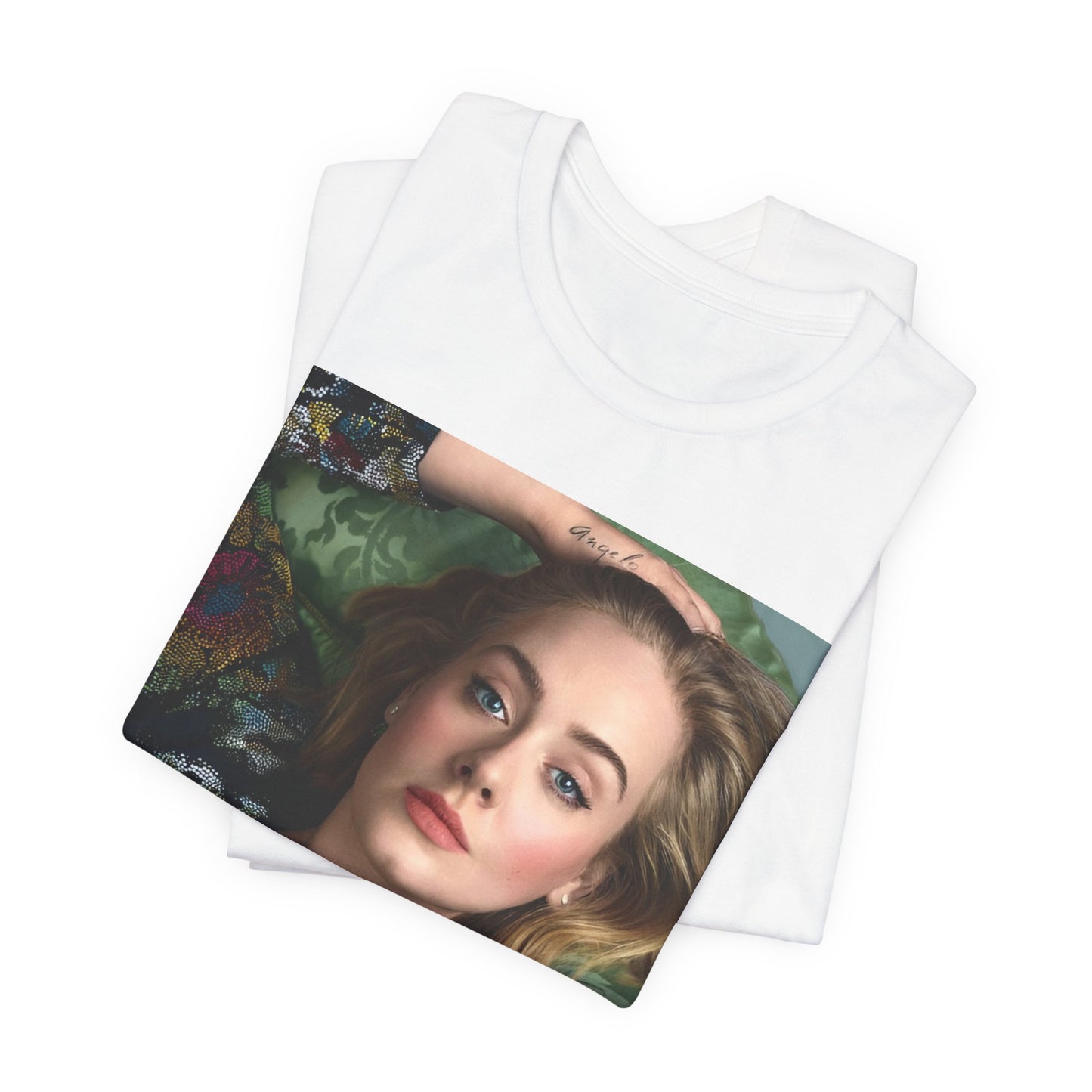 A black graphic t-shirt featuring a photo of Adele, possibly with floral elements or a floral background, showing a serene or contemplative expression.