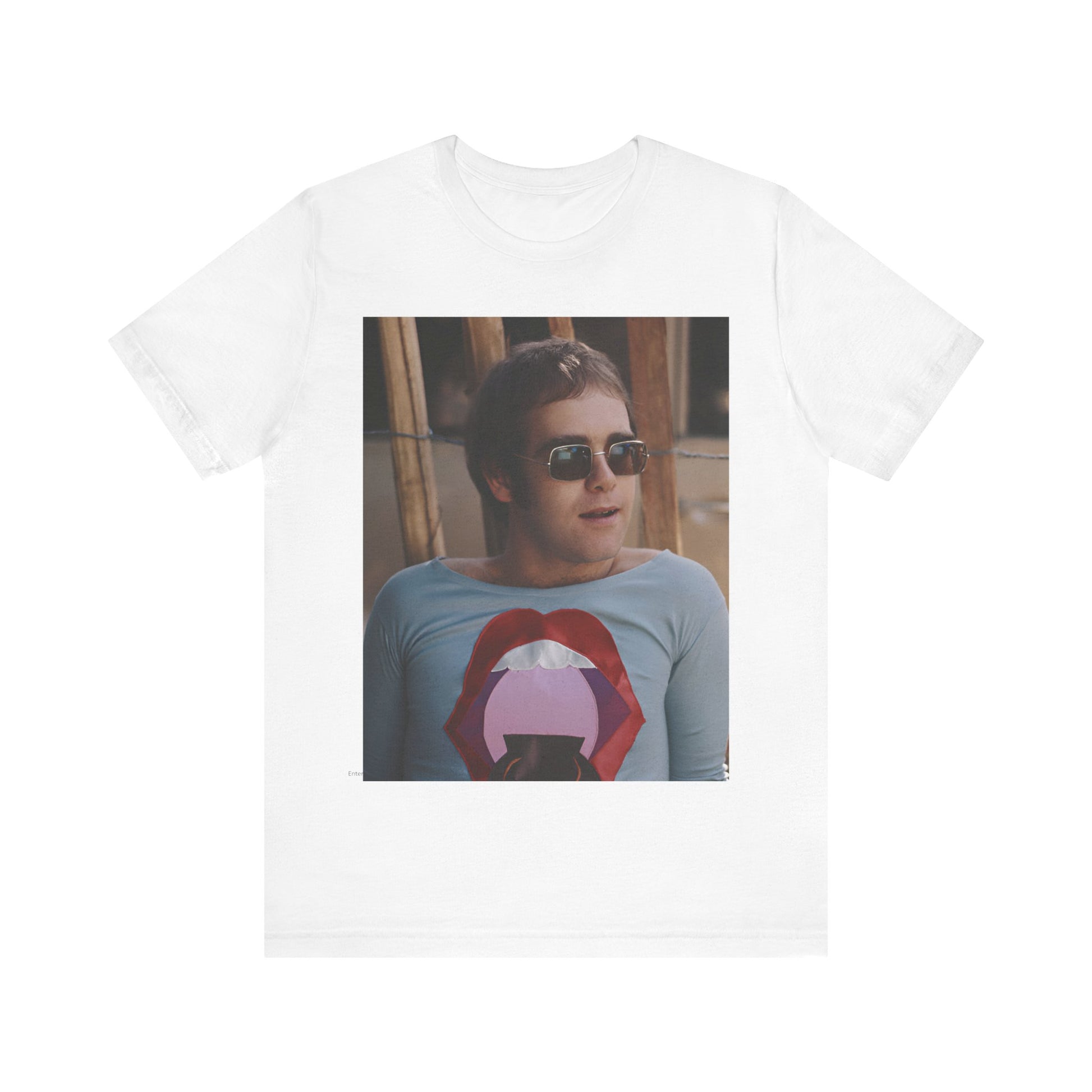A black graphic t-shirt featuring a classic graphic related to Elton John's 'Tiny Dancer' song or era.