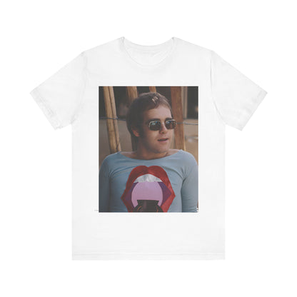 A black graphic t-shirt featuring a classic graphic related to Elton John's 'Tiny Dancer' song or era.