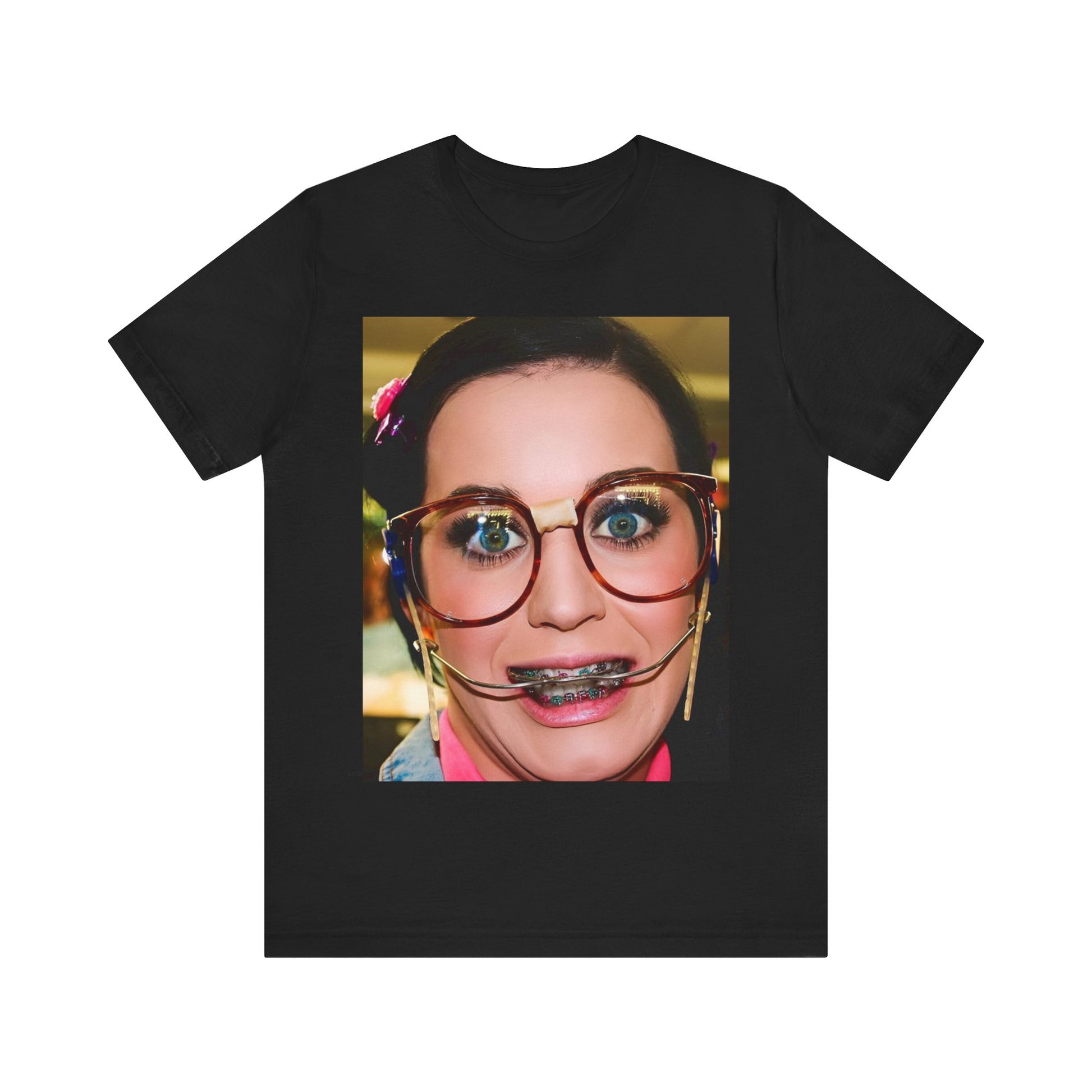 A black graphic t-shirt featuring a graphic related to Katy Perry's "I Kissed A Girl" song or era.