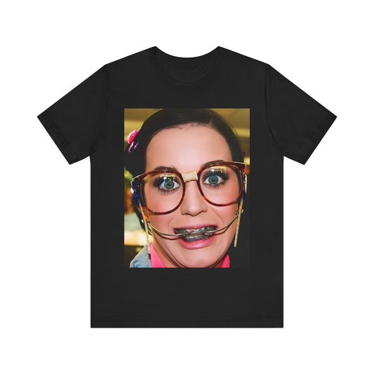 A black graphic t-shirt featuring a graphic related to Katy Perry's "I Kissed A Girl" song or era.