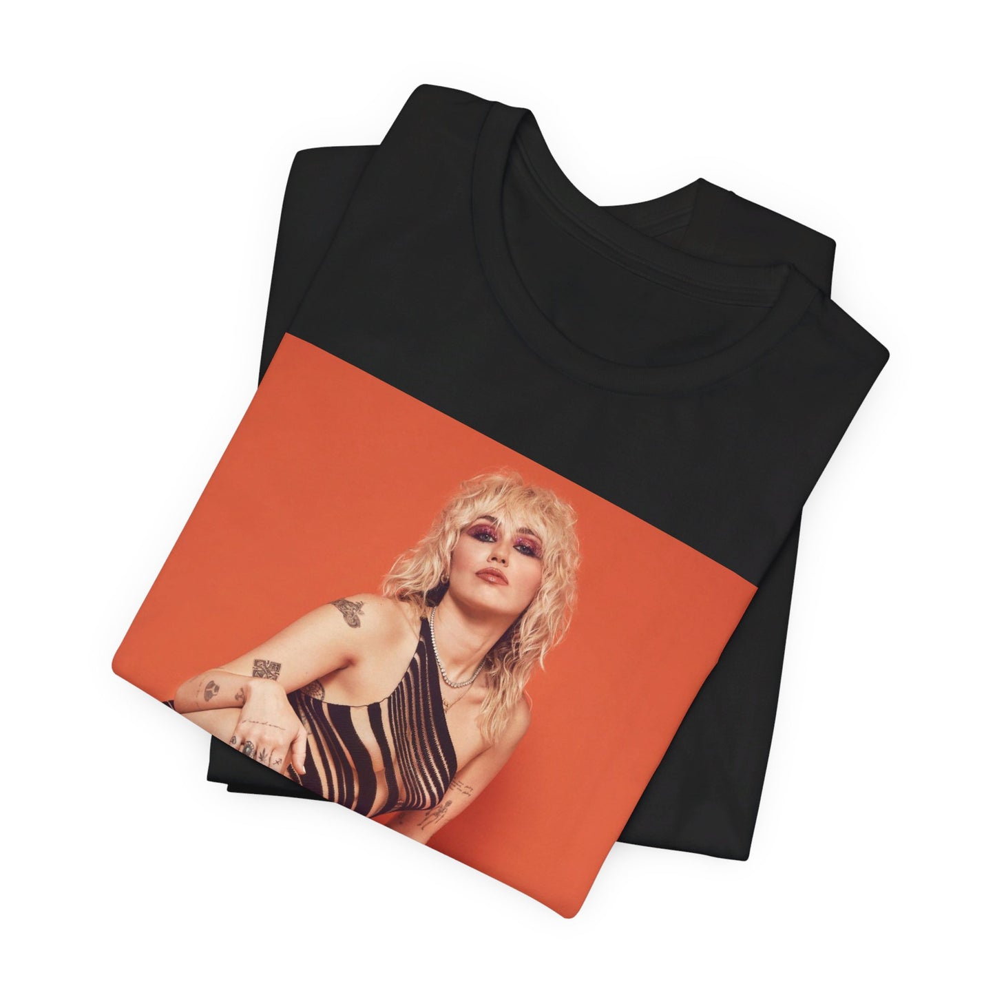 A black graphic t-shirt featuring a casual pop fan graphic of Miley Cyrus.